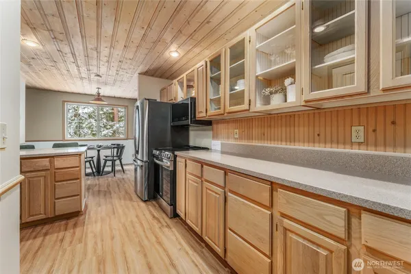 a kitchen with a sink stove and cabinets