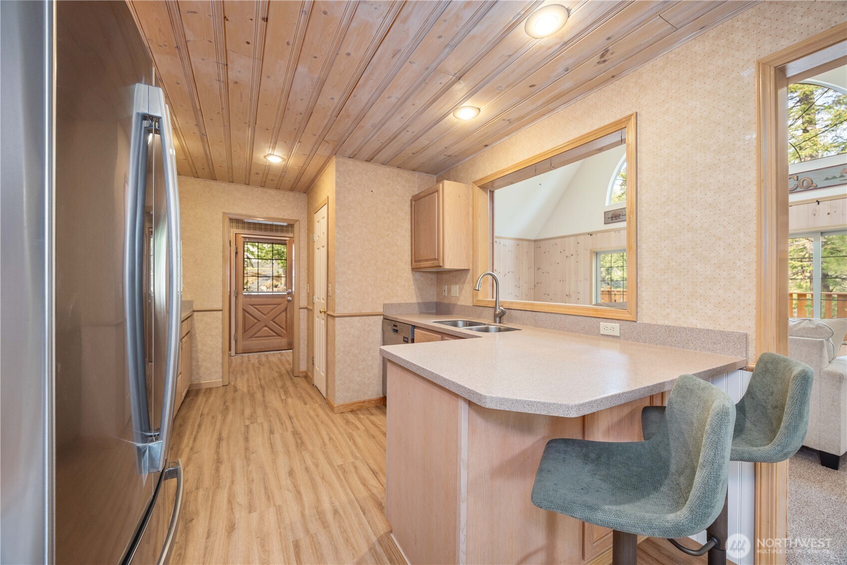 6545 Forest Ridge Drive Wenatchee, WA 98801 - Photo 12 of 40 a kitchen with kitchen island a stove a sink and a refrigerator