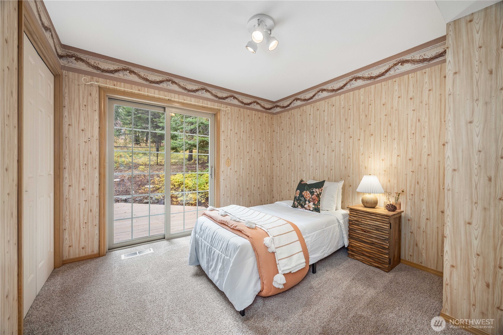 6545 Forest Ridge Drive Wenatchee, WA 98801 - Photo 18 of 40 a bedroom with a bed a ceiling fan and a window