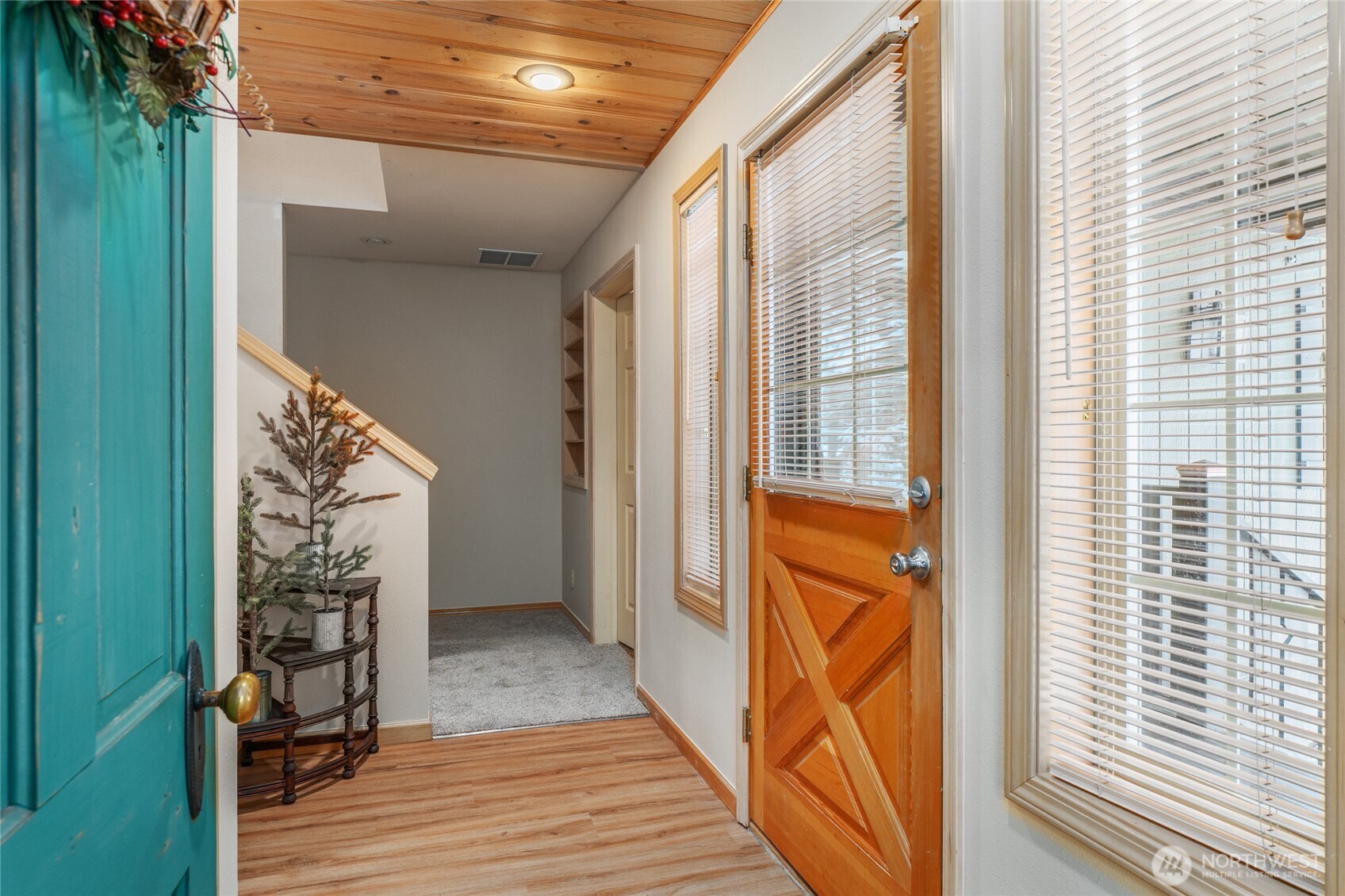 6545 Forest Ridge Drive Wenatchee, WA 98801 - Photo 6 of 33 a view of a porch with wooden floor and a floor to ceiling window
