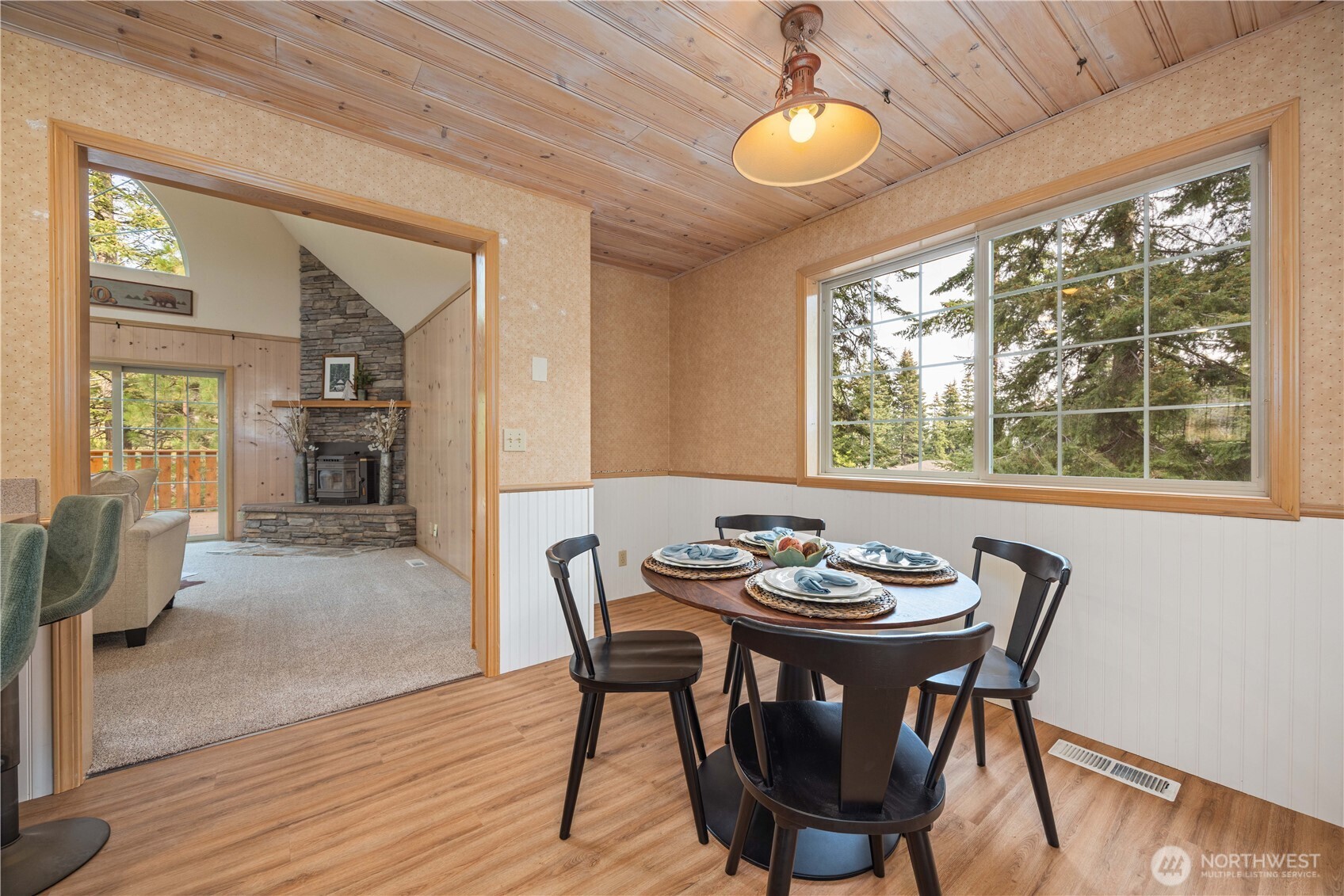 6545 Forest Ridge Drive Wenatchee, WA 98801 - Photo 9 of 40 a view of a dining room with furniture window and wooden floor