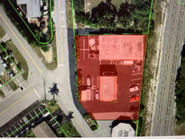 an aerial view of a house outdoor space and street view