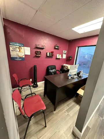 a view of a workspace with furniture