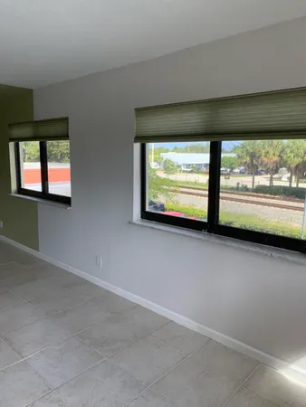 a view of an empty room with a window