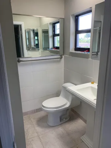a bathroom with a glass shower door
