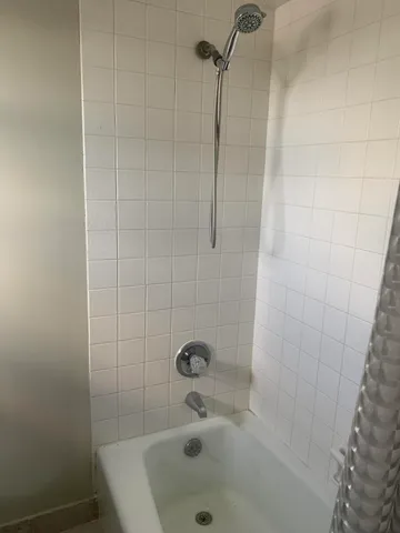 a room with a dresser and a window