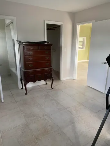 a view of living room with furniture and a window