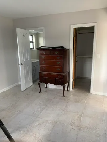 a white toilet sitting next to a bathroom sink