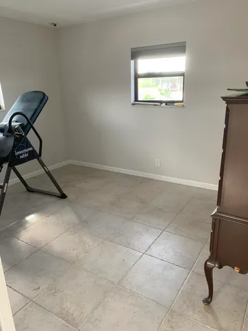 a view of room with window and fireplace