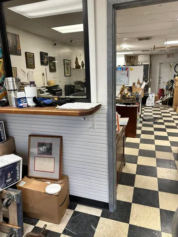 a hallway with a dining table and chairs