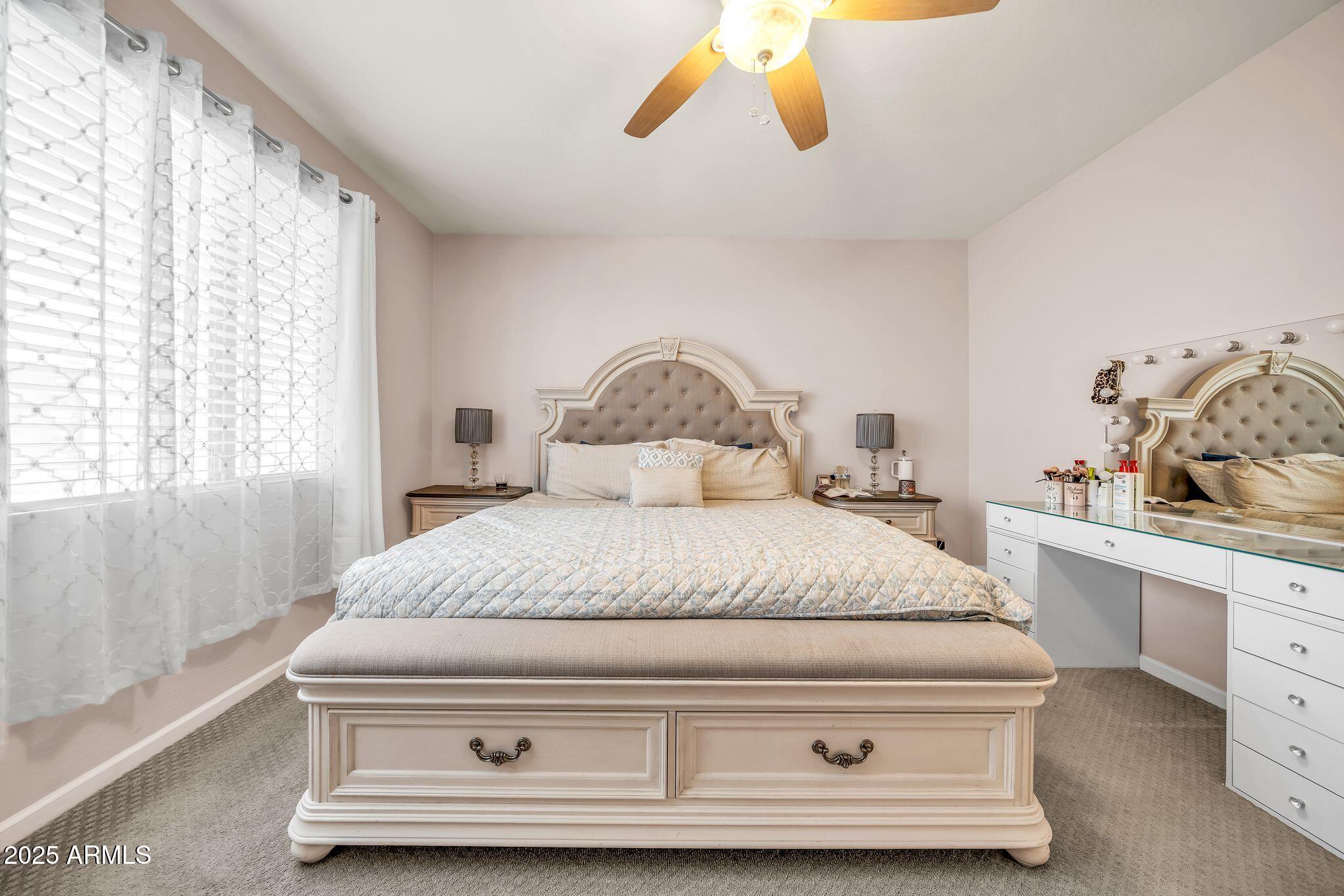 2292 South 155th Lane Goodyear, AZ 85338 - Photo 23 of 62 a bedroom with a bed and window