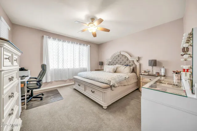 a view of walk in closet with clothes