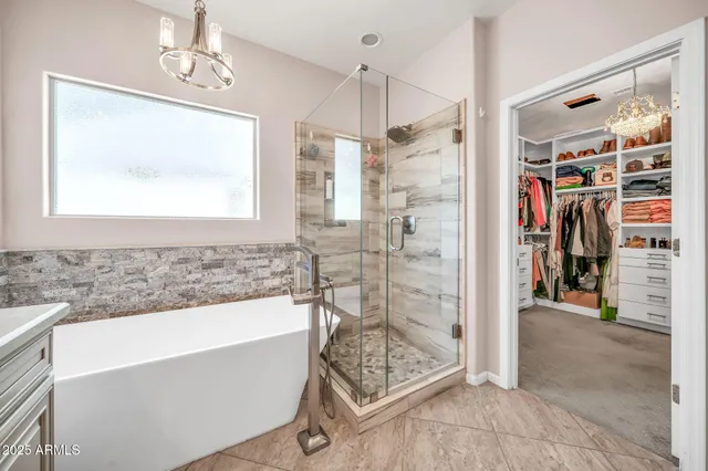 a bedroom that has a bed and a table in it