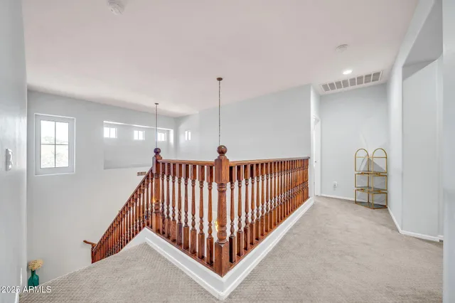 a bedroom with a bed dresser and a window