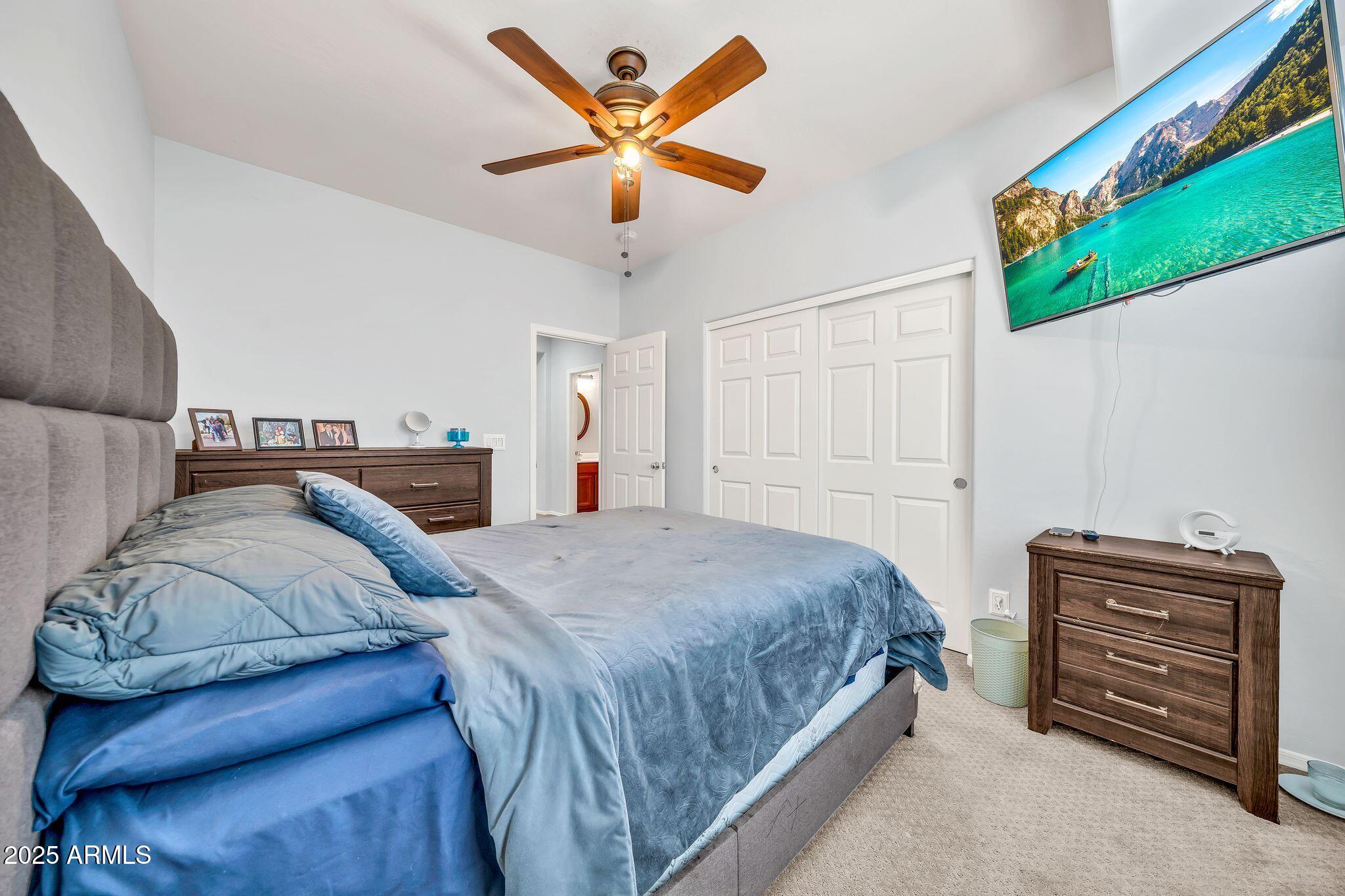 2292 South 155th Lane Goodyear, AZ 85338 - Photo 37 of 62 a bedroom with a bed and a dresser