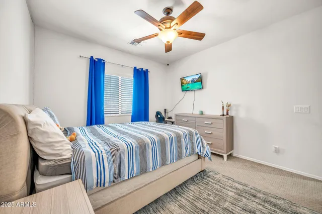a view of a backyard with plants and patio
