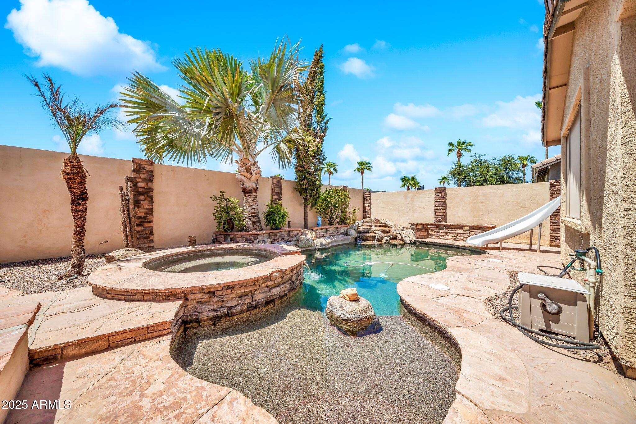 2292 South 155th Lane Goodyear, AZ 85338 - Photo 45 of 62 a view of a backyard with plants and patio