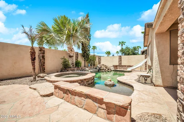 an aerial view of multiple houses with a yard