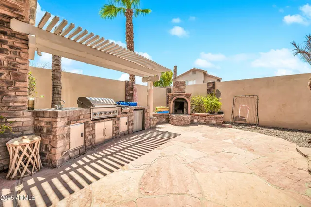 an aerial view of a house with garden space and street view