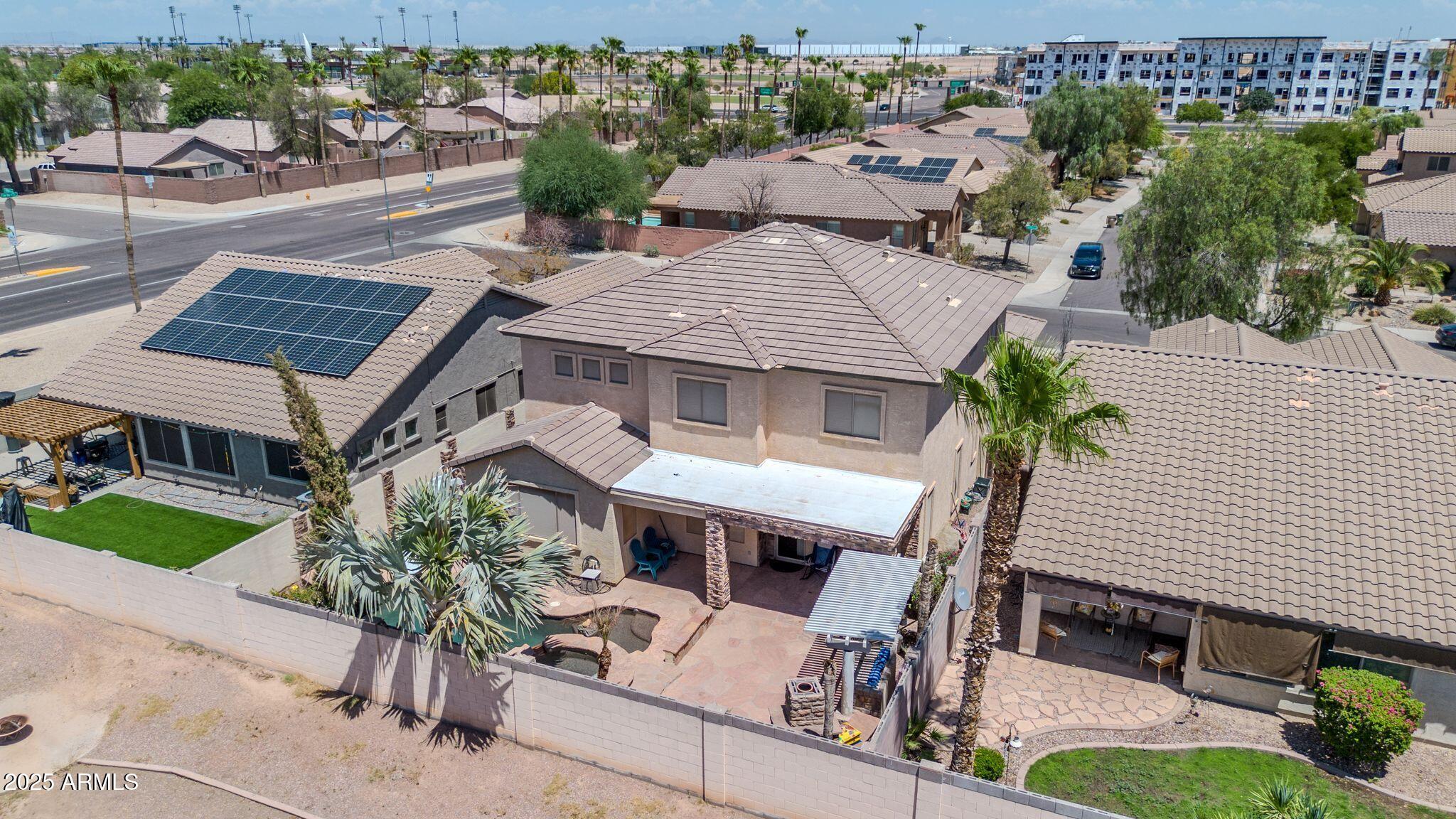 2292 South 155th Lane Goodyear, AZ 85338 - Photo 57 of 62 an aerial view of a house with garden space and street view