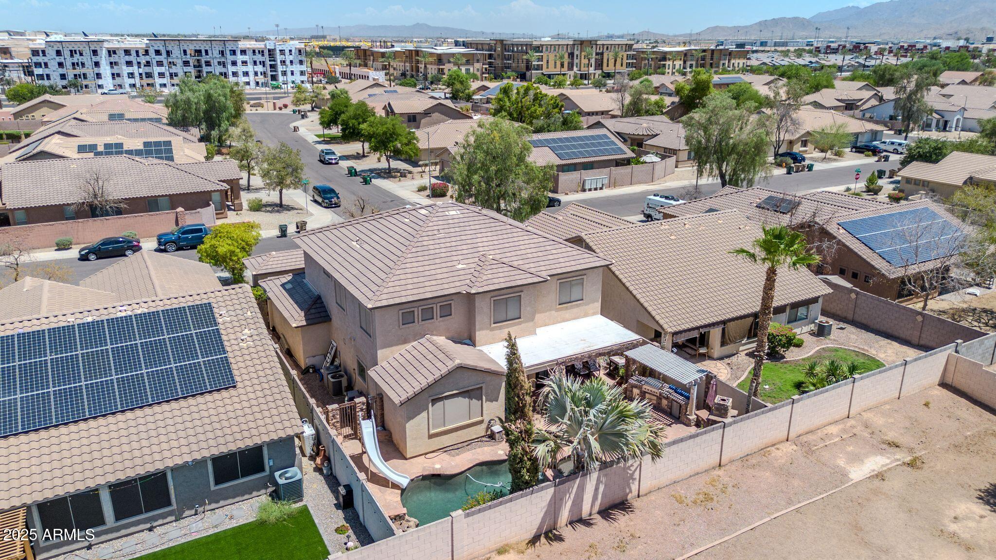 2292 South 155th Lane Goodyear, AZ 85338 - Photo 59 of 62 an aerial view of a house with garden space and street view