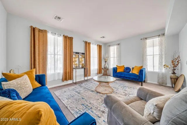 a living room with furniture and a large window