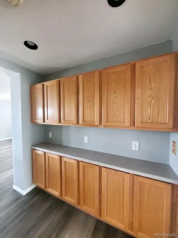 a kitchen with wooden cabinets a sink and dishwasher
