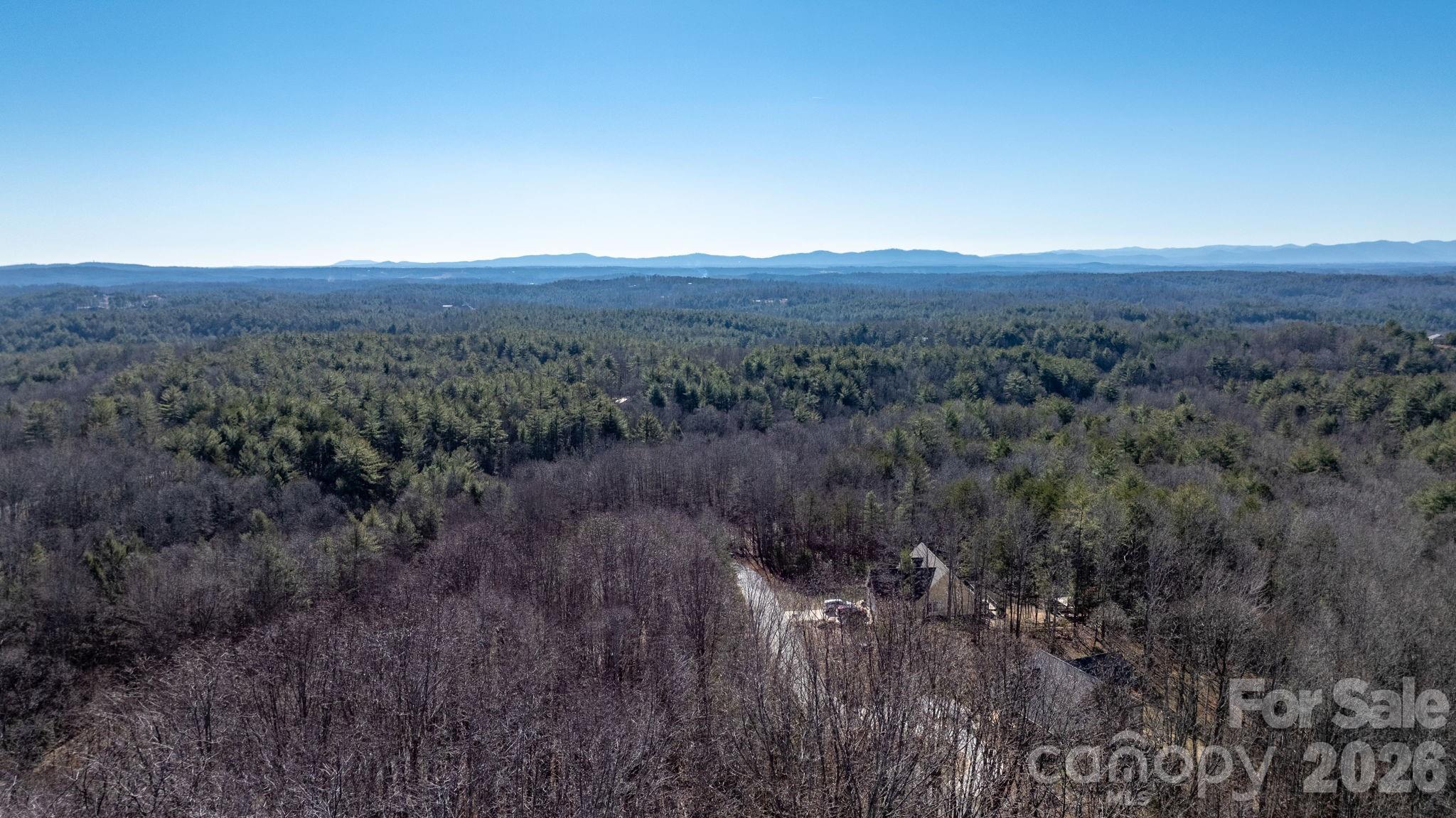 0 Round Rock Road Lenoir, NC 28645 - Photo 22 of 26 a view of a city with lush green forest