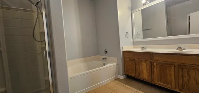 a bathroom with a bathtub and a sink