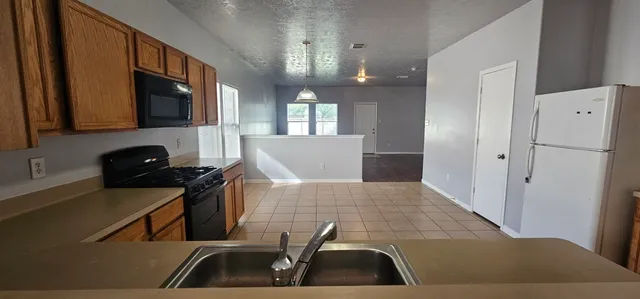 a view of kitchen with furniture and wooden floor