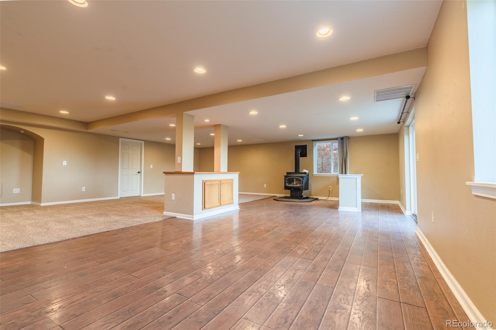 180 Deep Cut Road Livermore, CO 80536 - Photo 24 of 48 a view of kitchen and hall with wooden floor