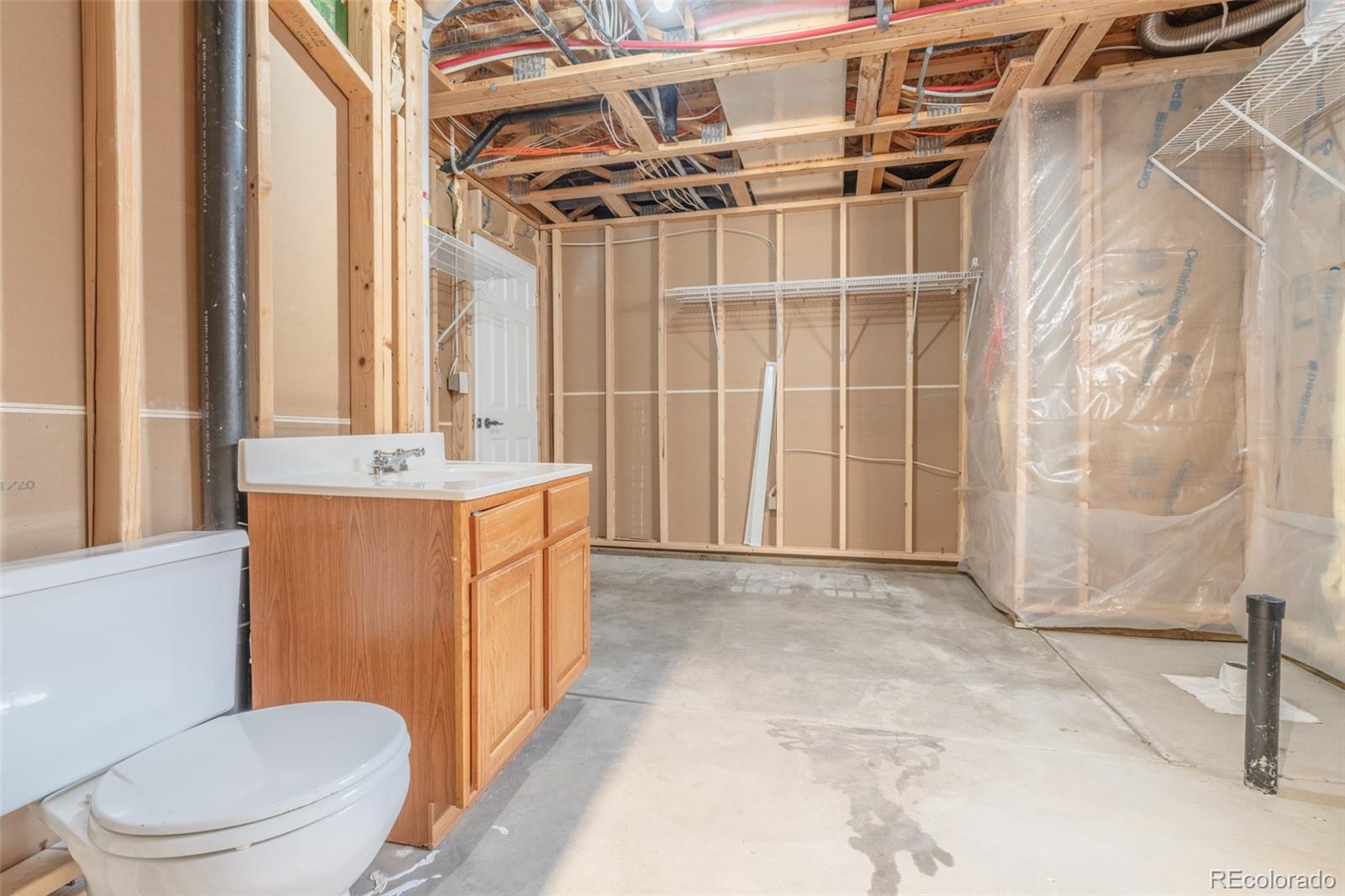 180 Deep Cut Road Livermore, CO 80536 - Photo 35 of 48 a bathroom with a sink toilet and shower