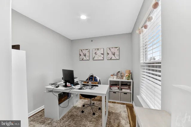 a view of a workspace with furniture