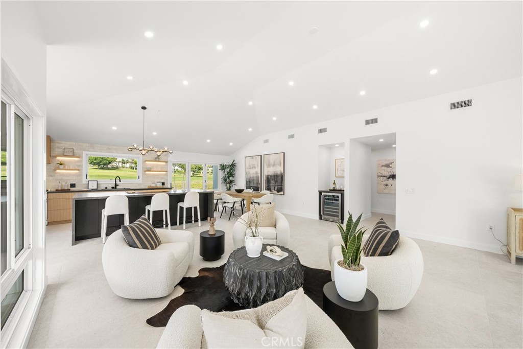 19741 Quiet Bay Lane Huntington Beach, CA 92648 - Photo 14 of 33 a living room with furniture kitchen and a table
