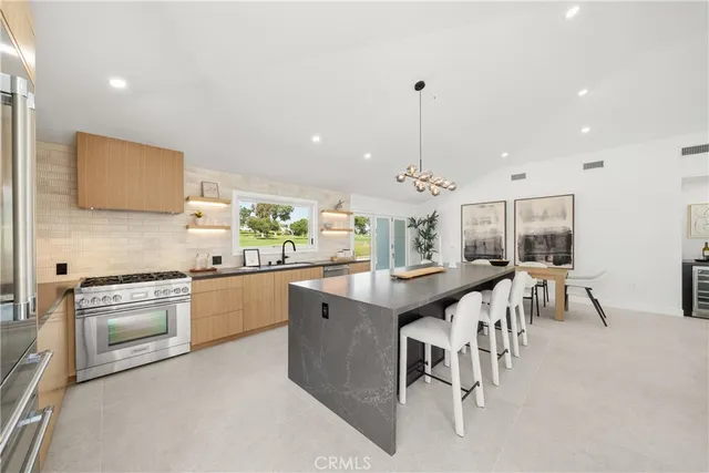 a view of a living room and kitchen area