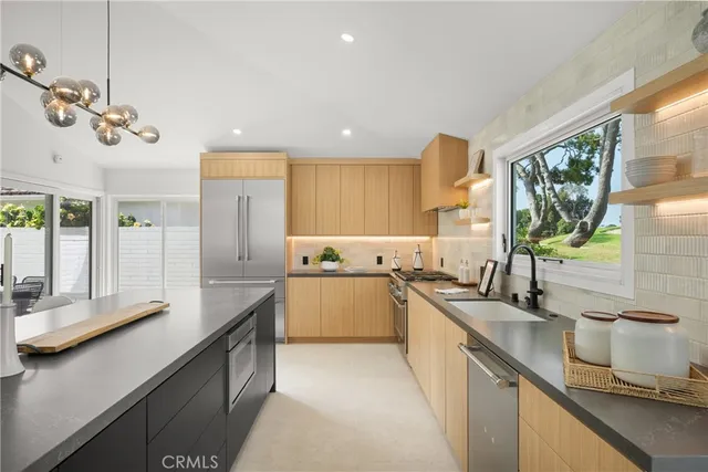 a dining room with furniture a window and a kitchen view