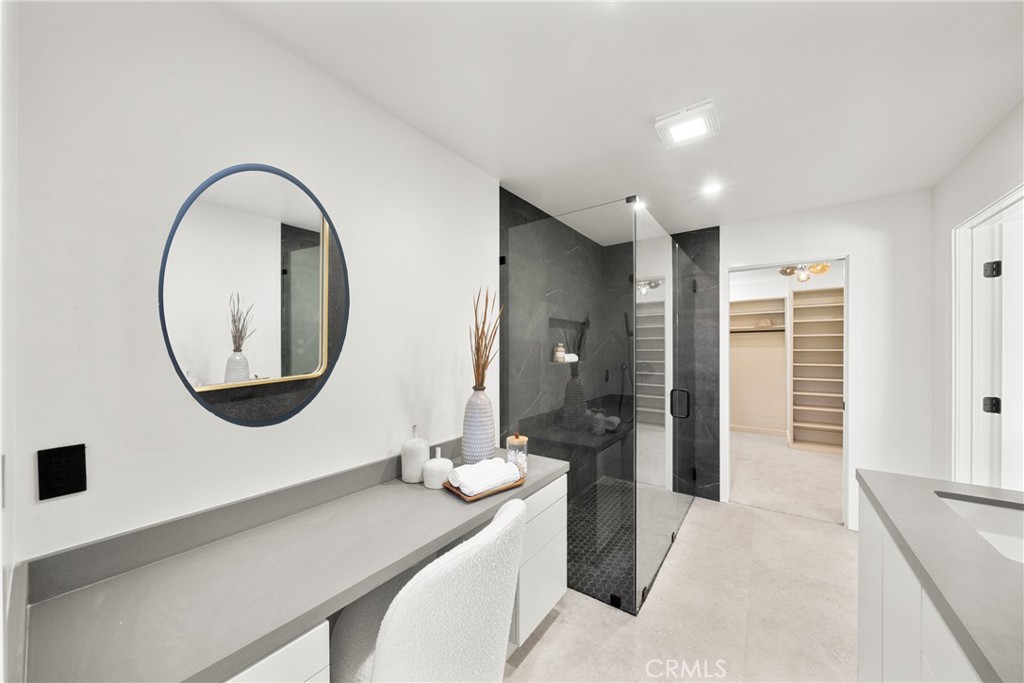 19741 Quiet Bay Lane Huntington Beach, CA 92648 - Photo 25 of 33 a bathroom with a sink and a mirror