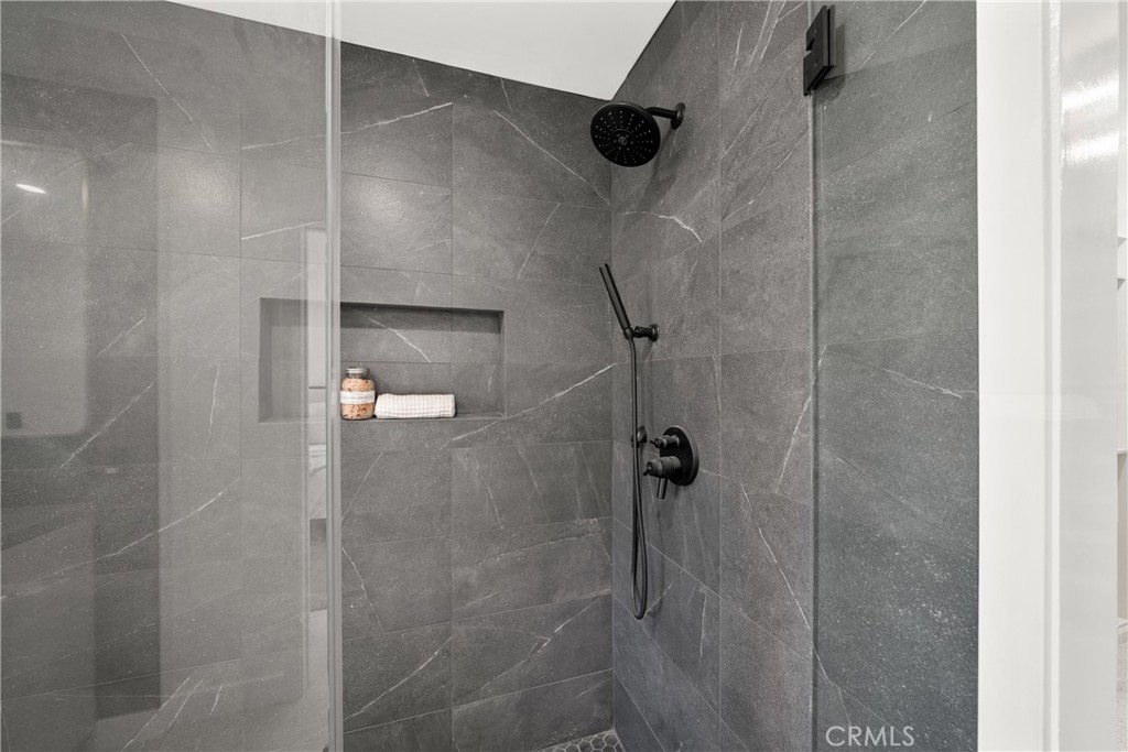 19741 Quiet Bay Lane Huntington Beach, CA 92648 - Photo 26 of 33 a bathroom with a shower