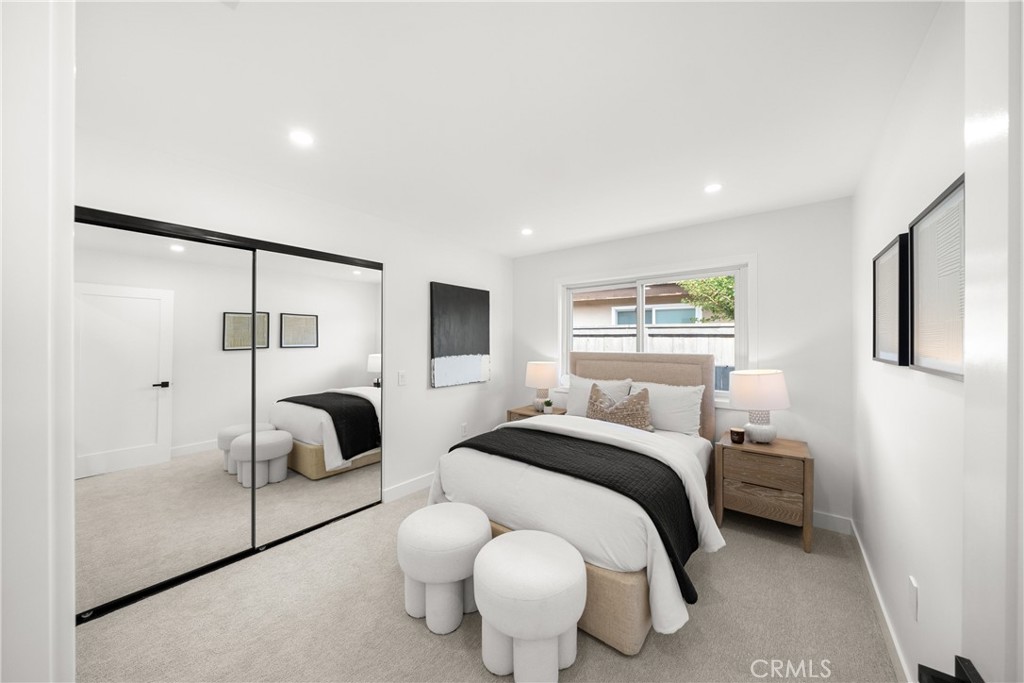 19741 Quiet Bay Lane Huntington Beach, CA 92648 - Photo 28 of 33 a bedroom with a bed and window