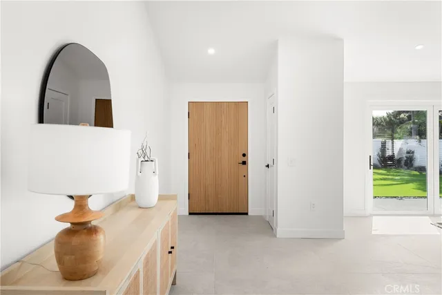 a living room with furniture and a table