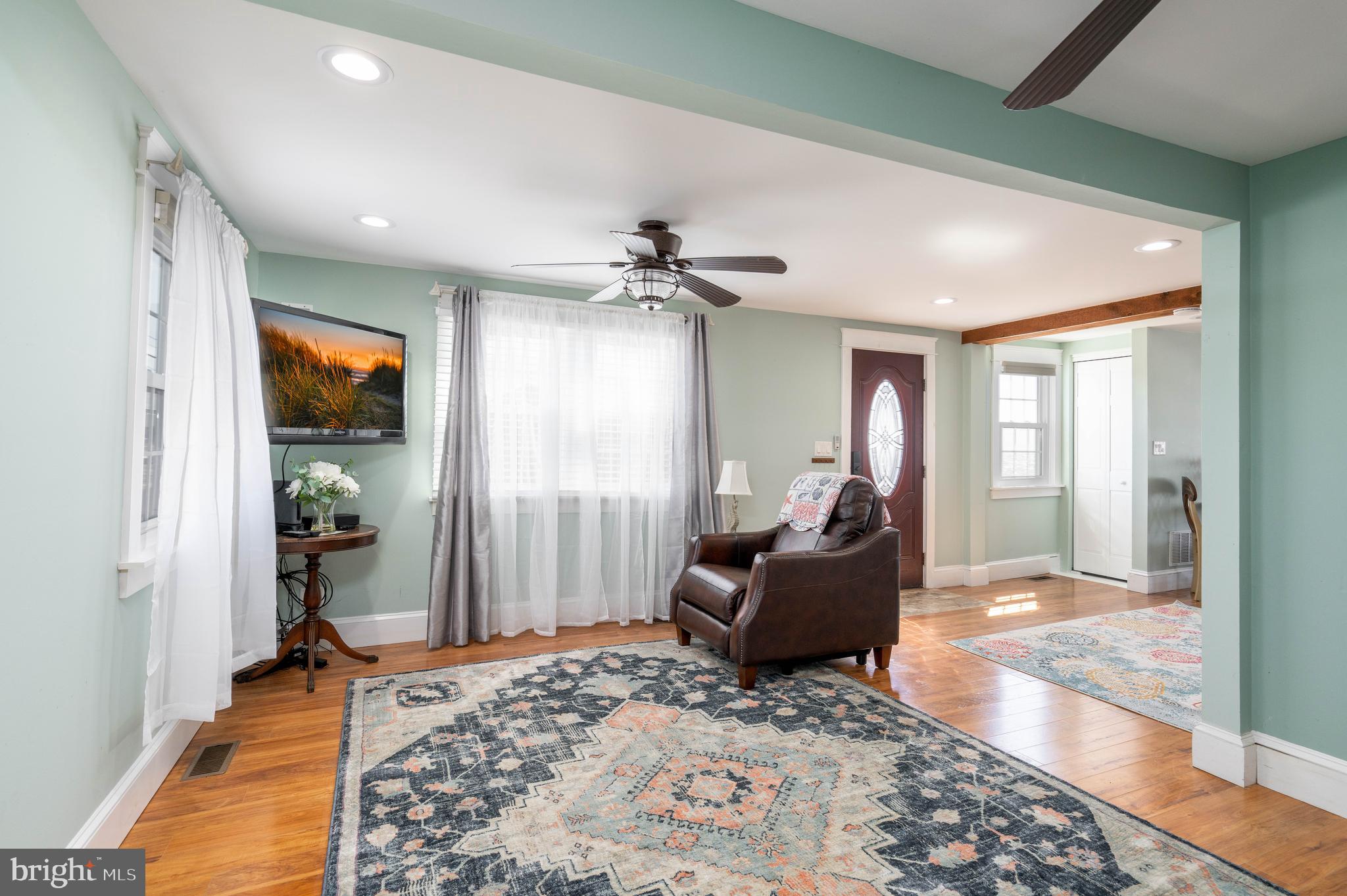 98 Delaware Avenue Fortescue, NJ 08321 - Photo 17 of 51 a living room with furniture and a chandelier