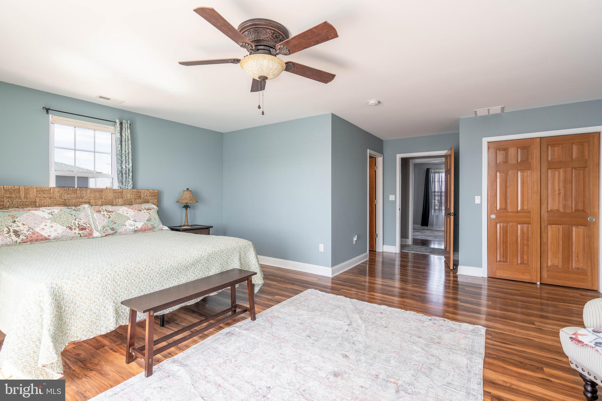 98 Delaware Avenue Fortescue, NJ 08321 - Photo 24 of 51 a bedroom with a bed and wooden floor