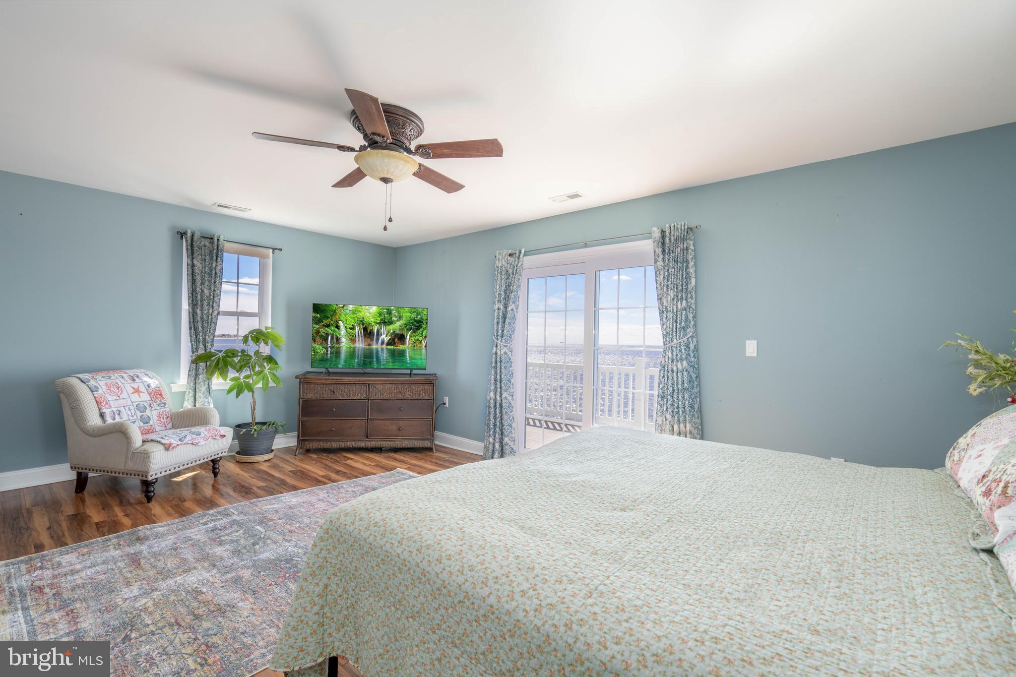 98 Delaware Avenue Fortescue, NJ 08321 - Photo 25 of 51 a bedroom with a bed and ceiling fan