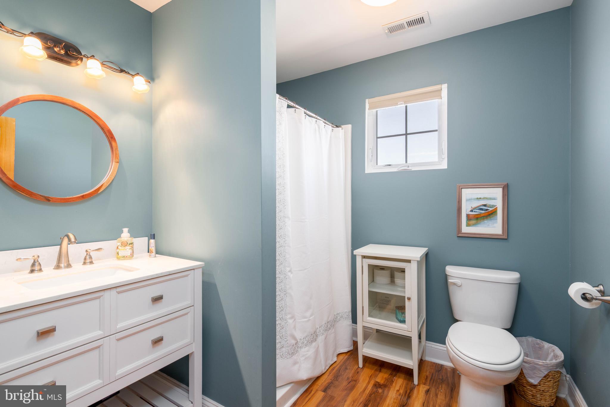 98 Delaware Avenue Fortescue, NJ 08321 - Photo 26 of 51 a bathroom with a toilet a sink and mirror