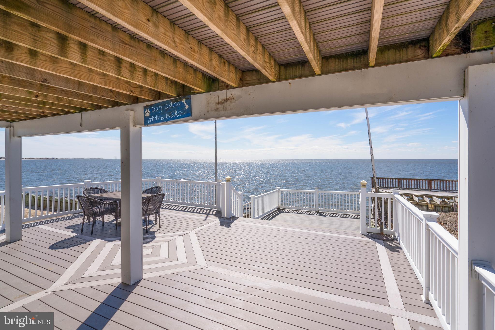 98 Delaware Avenue Fortescue, NJ 08321 - Photo 31 of 51 a bedroom with a bed a table and chair