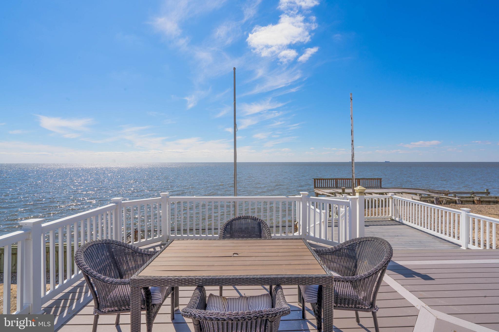 98 Delaware Avenue Fortescue, NJ 08321 - Photo 32 of 51 a view of a roof deck with table and chairs