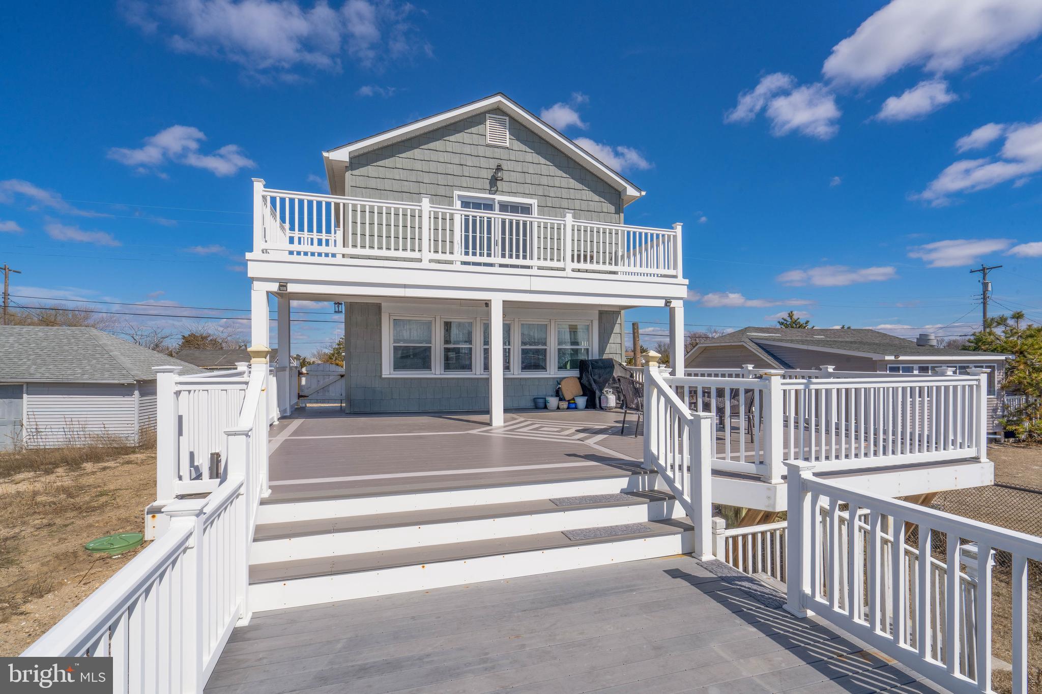 98 Delaware Avenue Fortescue, NJ 08321 - Photo 34 of 51 a front view of a house with a porch