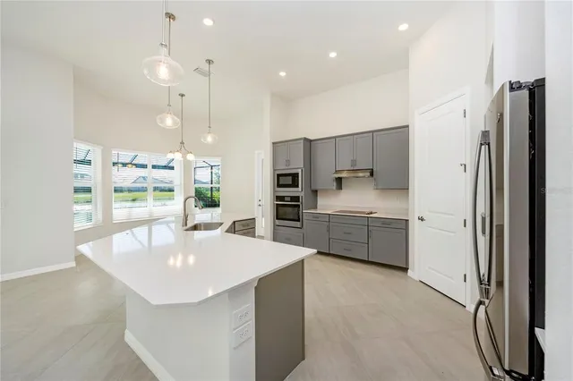 a spacious bathroom with a granite countertop sink and a mirror