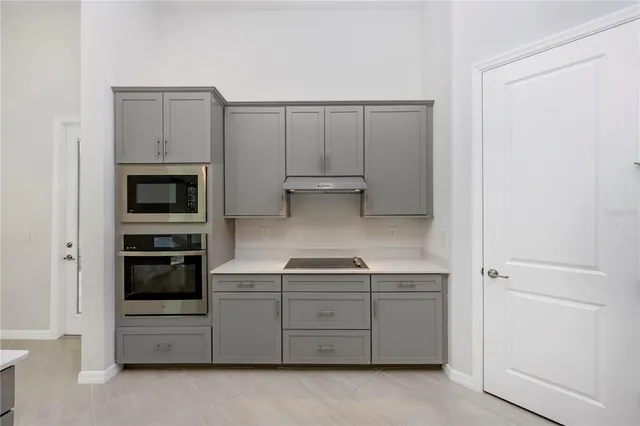 a view of a livingroom with a ceiling fan and window