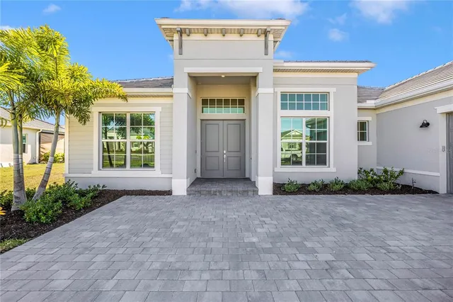 an empty room with windows and entrance